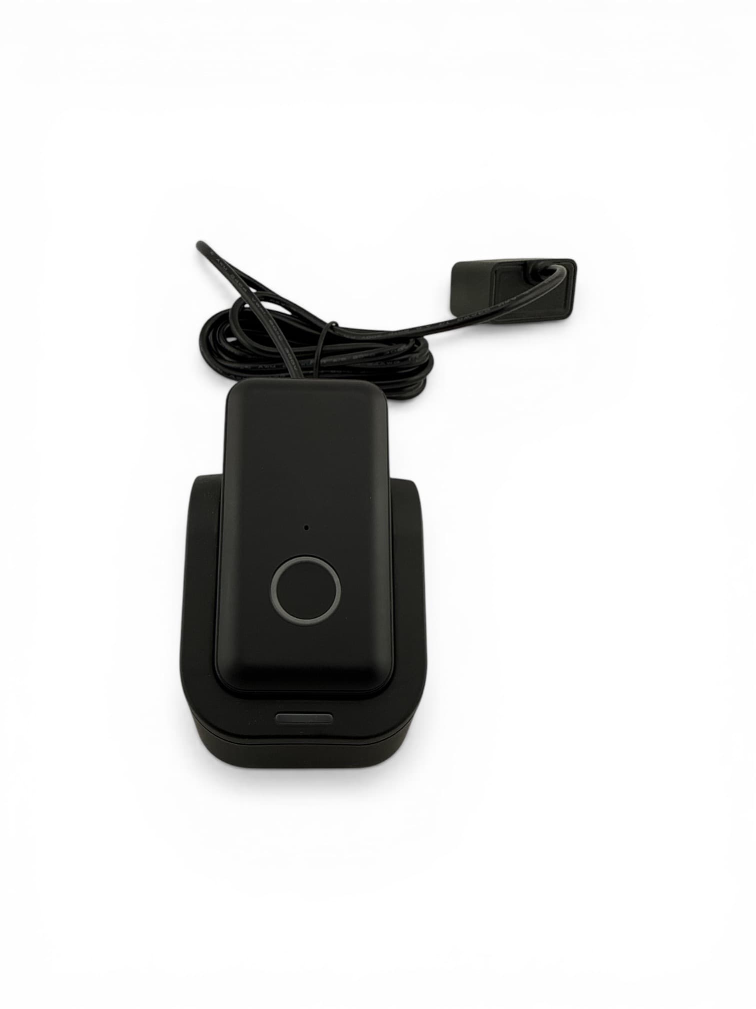 Indy Mobile portable GPS medical alert clipped to a senior woman's belt while walking through a sunny park - view 4